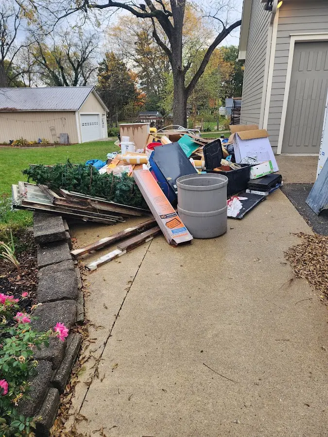 Dumpster being loaded with debris for Commercial Dumpster Rental in Green Acres